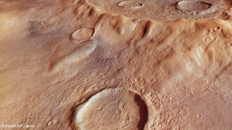 Illustration for article titled Stunning New Close-Ups Of The Largest Crater On Mars